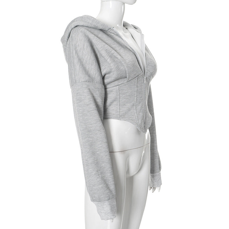 Grey zip-front cropped hoodie shown from a front-side angle on a mannequin.