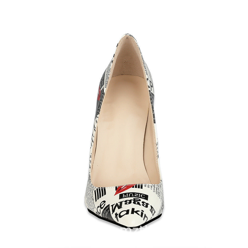 Headline newspaper-print pointed stiletto pump front view