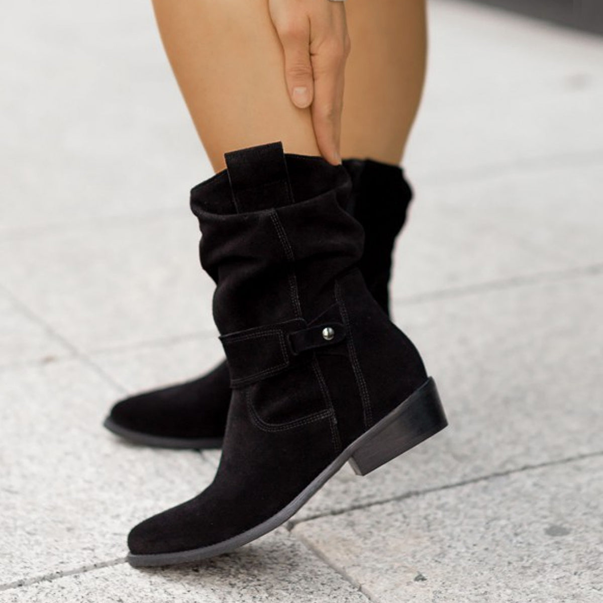 Saddle Sway Suede Boots shown in a repeated black supplier source view.