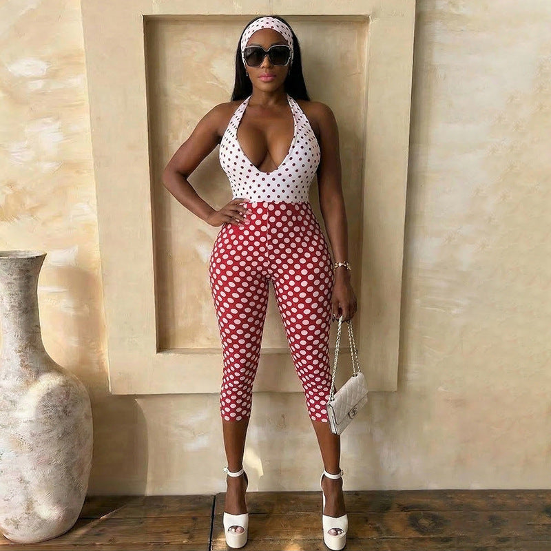Adult model wearing the red-and-white polka-dot cropped halter jumpsuit; accessories are styling only.