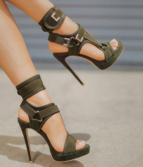 Army green buckle platform sandals worn close up