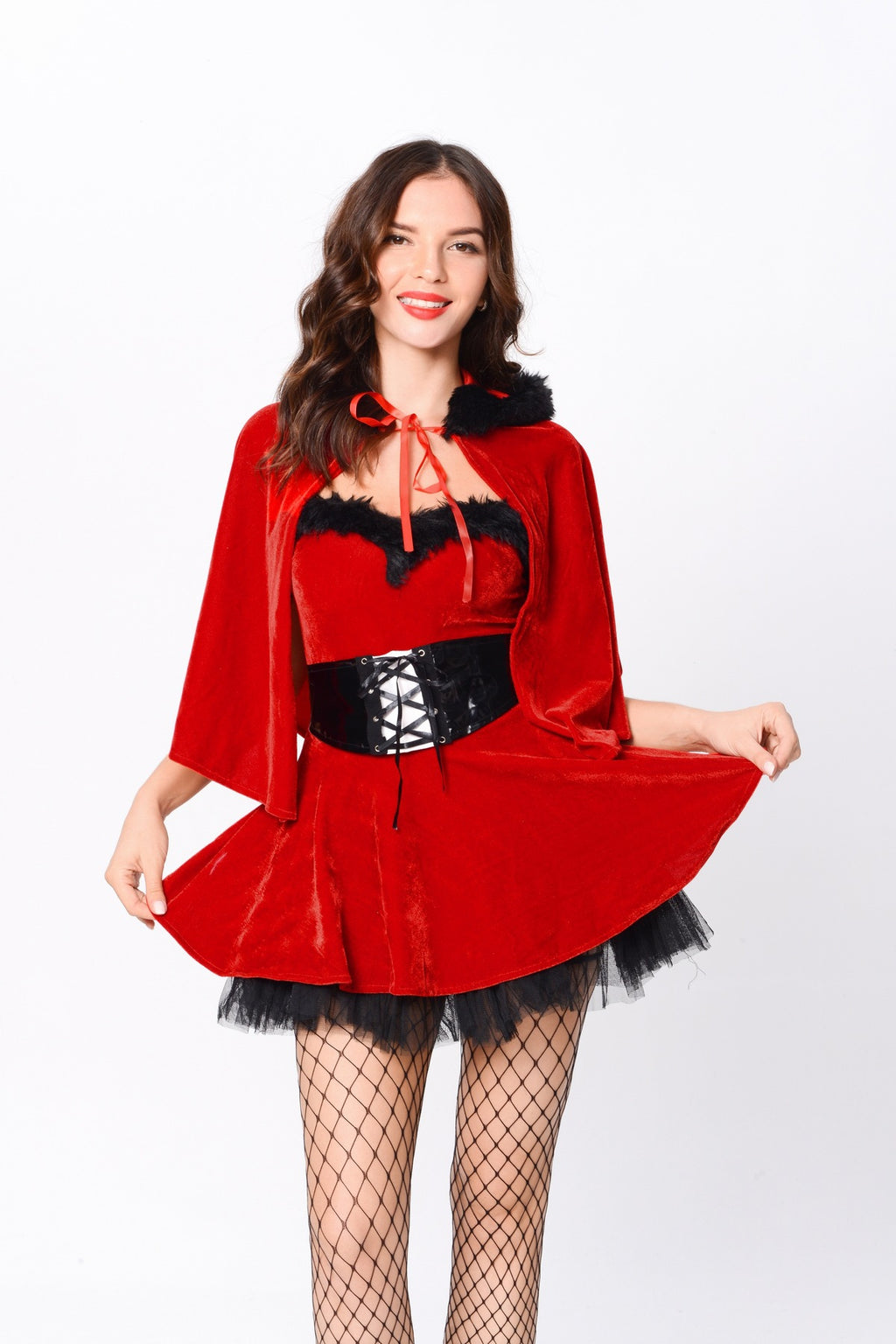 Close front view of the red dress, black trim, cape and lace-up waist piece.