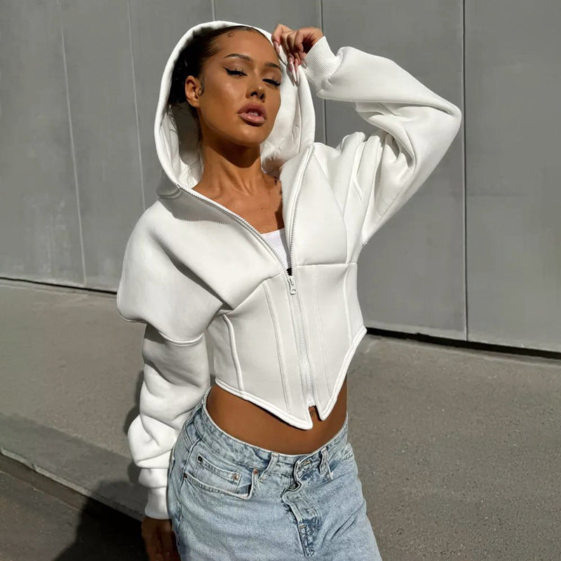 Adult model wearing the white zip-front corset-style hoodie, front outdoor view.
