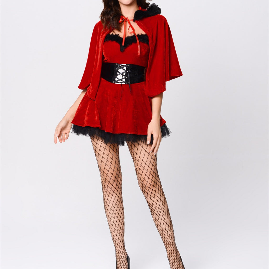 Adult model wearing the red Mistletoe Mischief Cape Set with black waist piece, front view.
