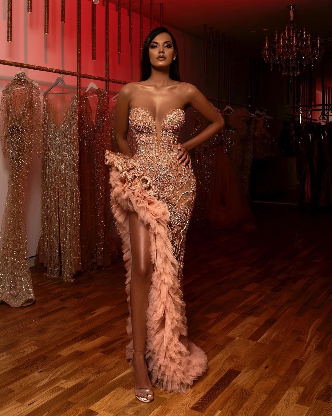 Full-length front view of Champagne Drama Sequin Gown with high slit and feathered train