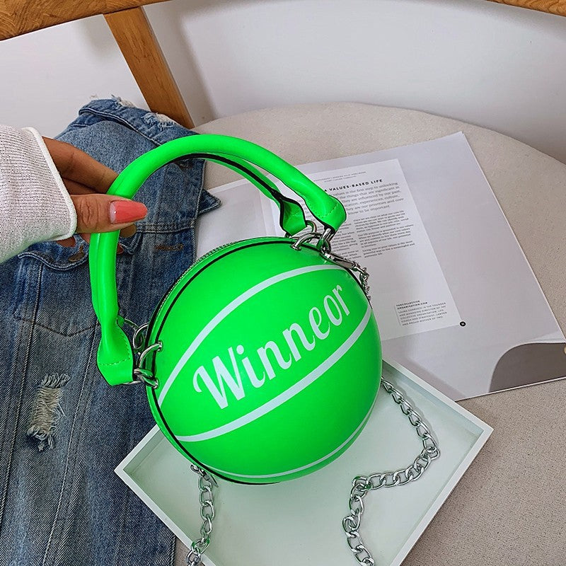 Basketball-shaped bag supplier example in green showing round body, zipper and chain strap