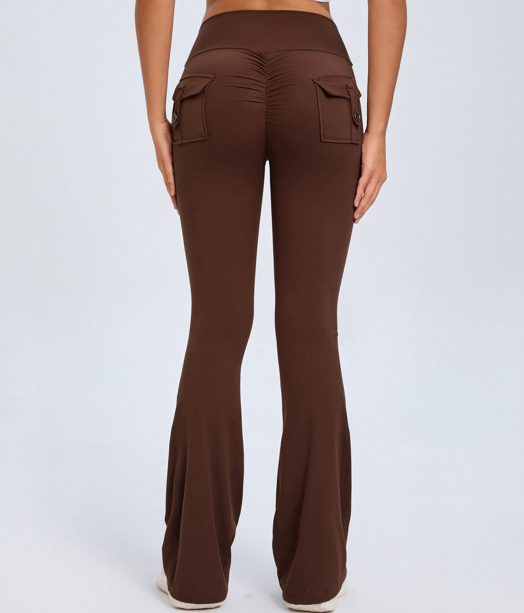Brown high-waisted flare pants shown from the back with ruched seam and two buttoned flap pockets.