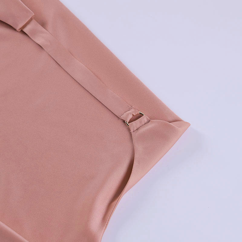 Close-up of the adjustable pink halter strap on the Champagne Hour mini dress