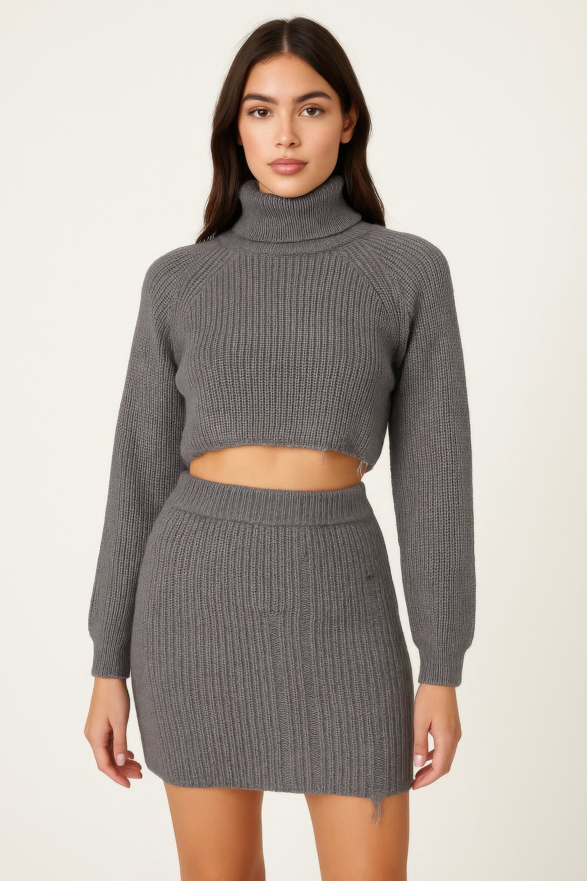 Front view of the charcoal-gray Knit Mock Neck Top And Skirt showing the cropped long-sleeve ribbed top and high-waist mini skirt