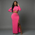 Pink Authority Maxi Set studio front view with crossover long-sleeve crop top, gold hip ornament and high side slit