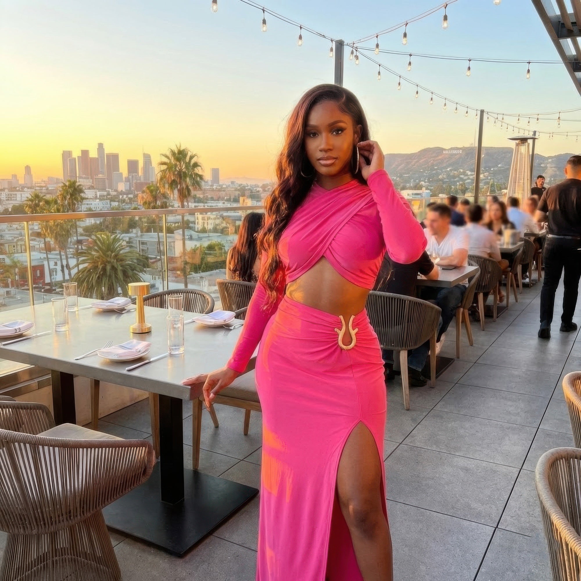 Pink Authority Maxi Set rooftop restaurant view showing crossover top and high-slit maxi skirt