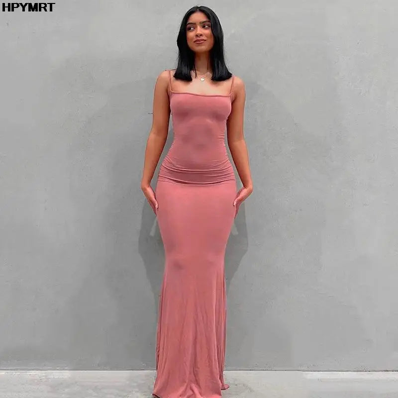 Adult model wearing the pink Golden Hour Satin Slip Dress, full-length front view