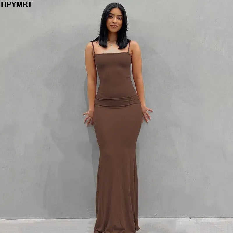 Adult model wearing the brown Golden Hour Satin Slip Dress, full-length front view