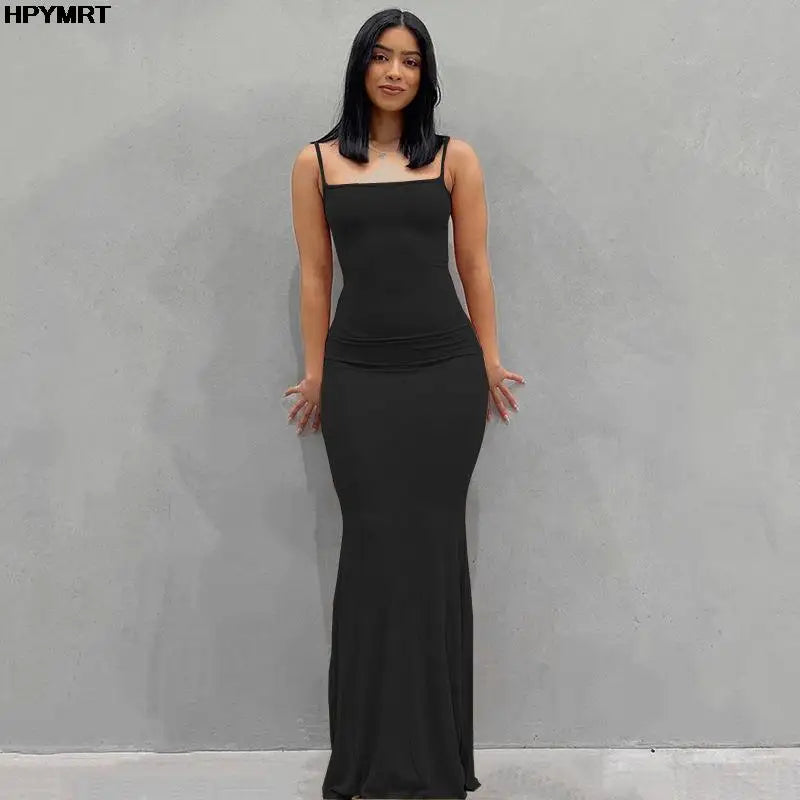 Adult model wearing the black Golden Hour Satin Slip Dress, alternate full-length front view