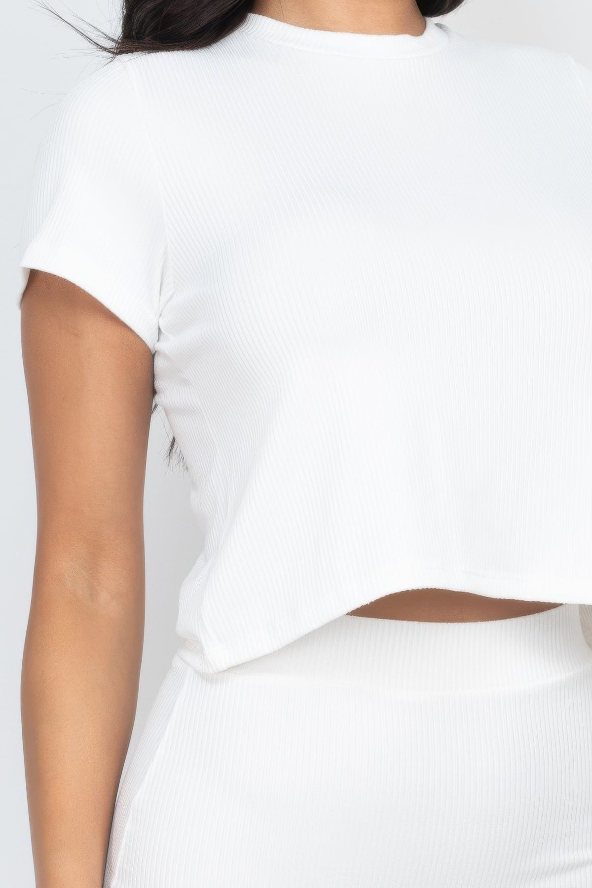 Close view of fine rib texture and crop hem on white Soft Focus Ribbed Midi Set