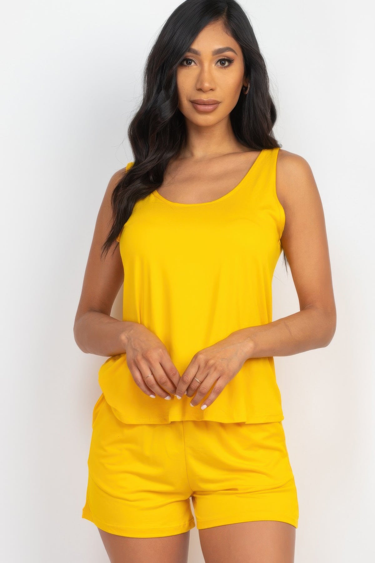 Adult model wearing the Daylily Yellow Comfy Tank Top & Shorts Set with scoop-neck tank and pocketed shorts