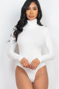 White Ribbed Turtle Neck Long Sleeve Bodysuit shown from the front with fitted sleeves and high-cut leg openings
