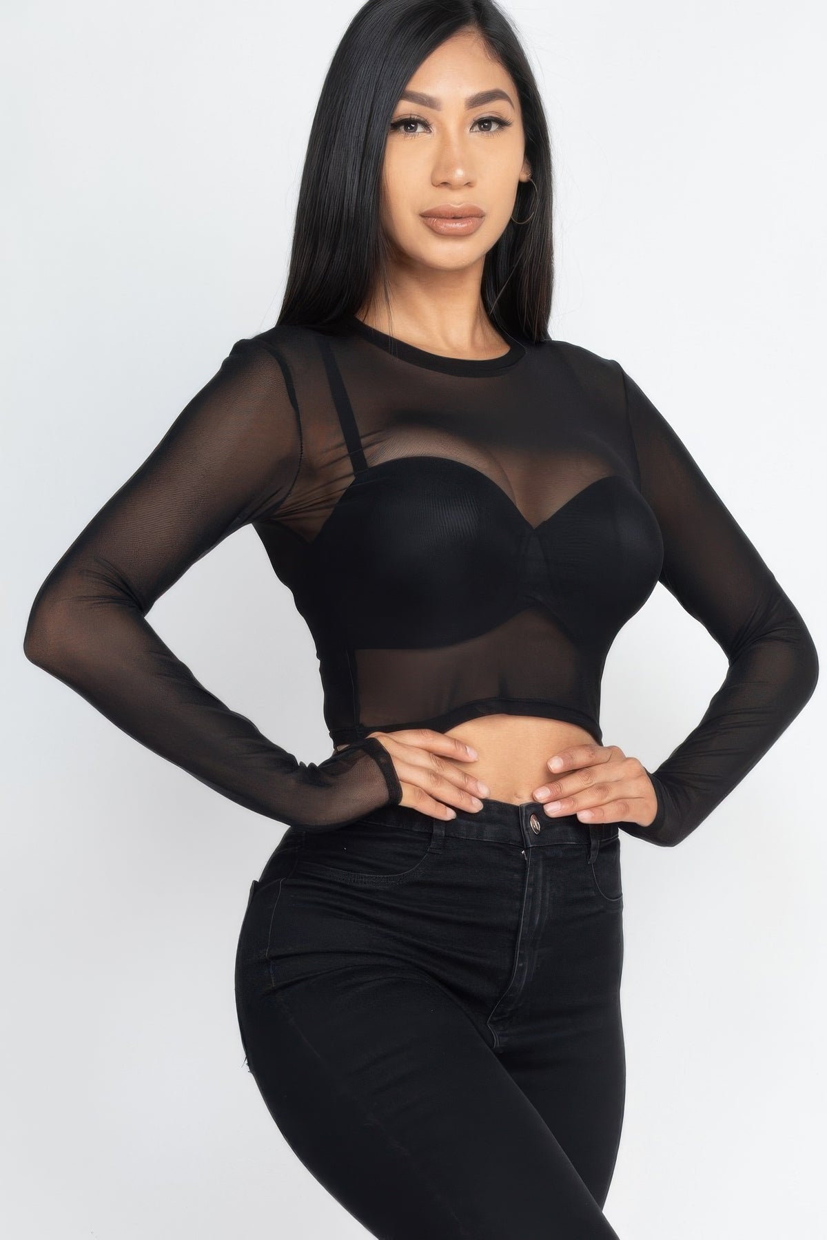 Close front view of the black After Dark Sheer Mesh Crop Top showing the crew neckline and sheer torso