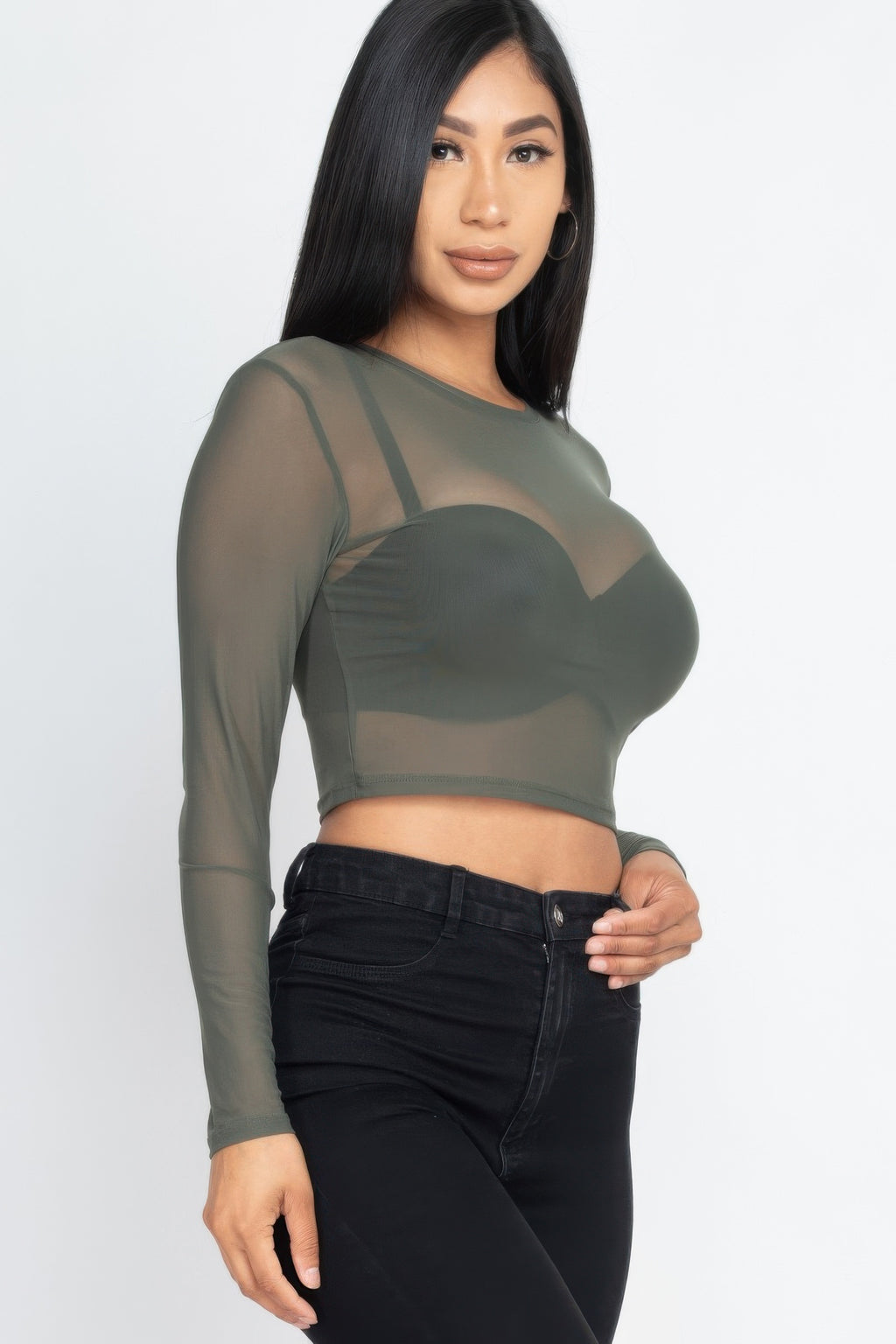 Close three-quarter view of the olive After Dark Sheer Mesh Crop Top showing the transparent mesh