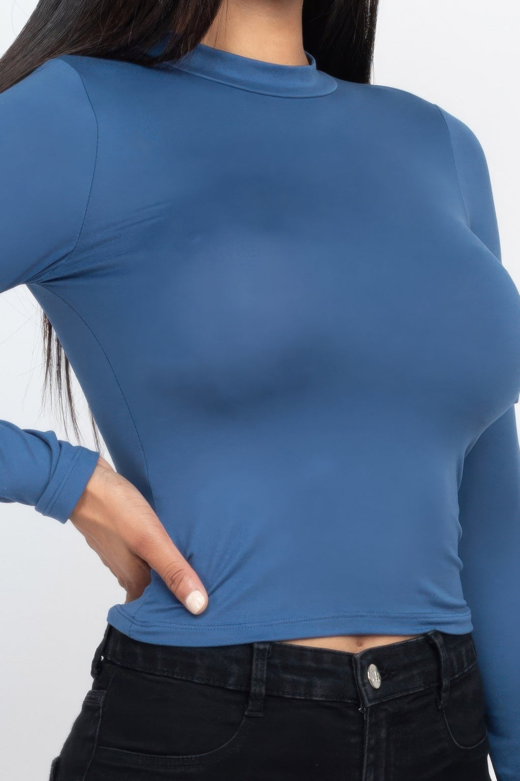 Close detail of the Blue Haze Mock Neck Solid Long Sleeve Top showing the shallow neck, smooth fabric, and straight hem