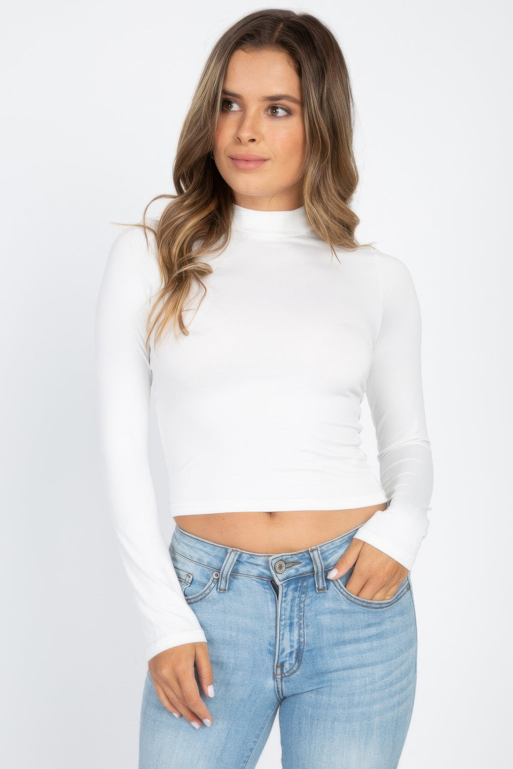White Mock Neck Solid Long Sleeve Top shown from the front with light blue jeans