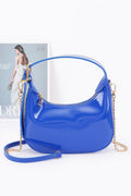 Cobalt Enamel Hobo Bag with glossy finish, short handle and detachable gold-chain strap, front view