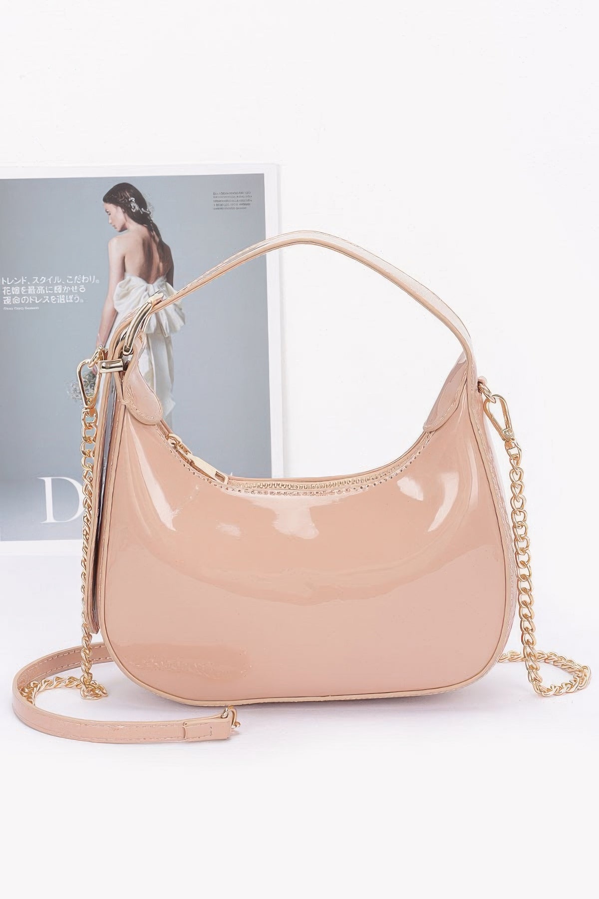 Nude Enamel Hobo Bag with glossy finish, short handle and detachable gold-chain strap, front view