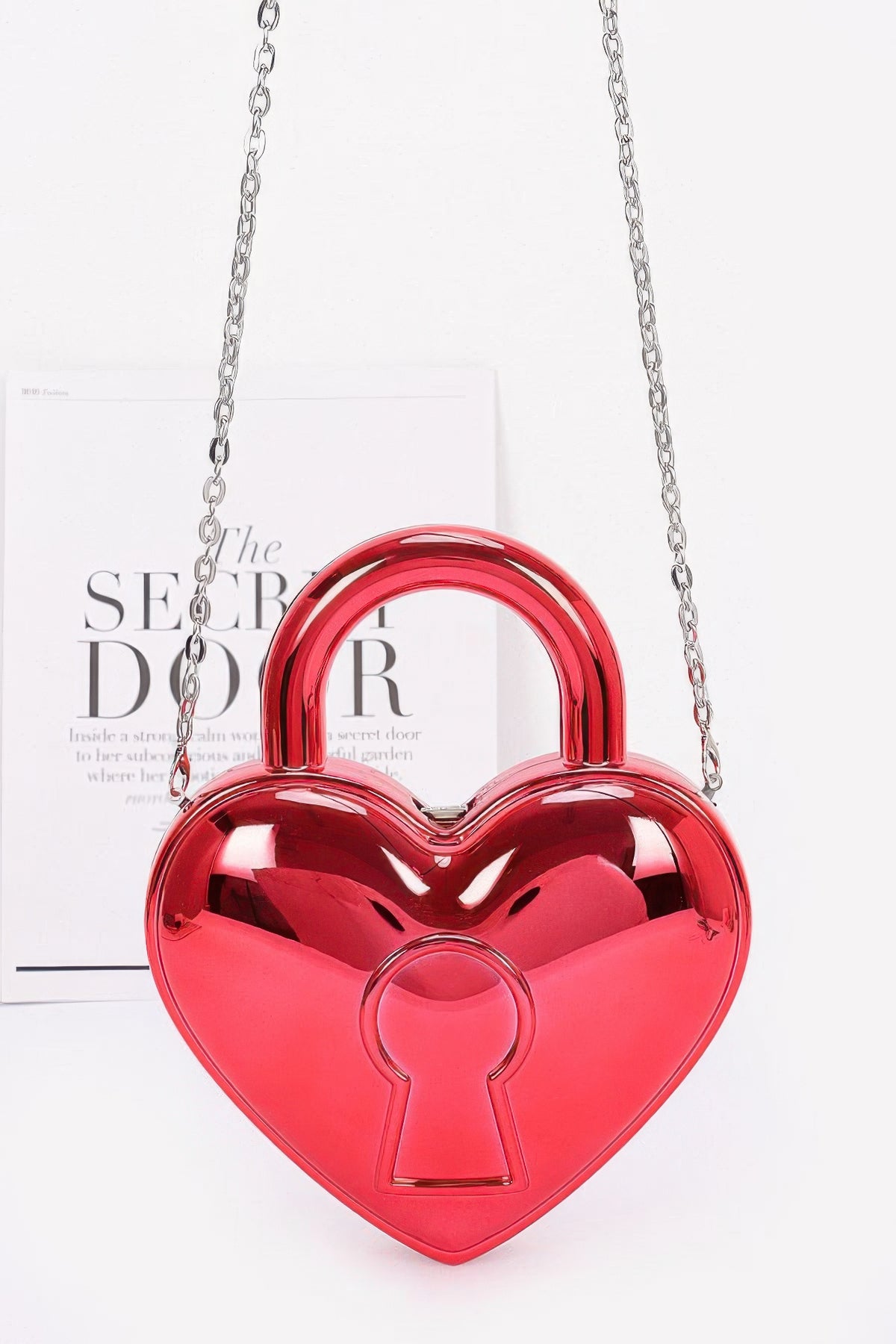 Red heart-shaped Metallic Acrylic Bag with rounded top handle, keyhole motif and silver-tone chain strap