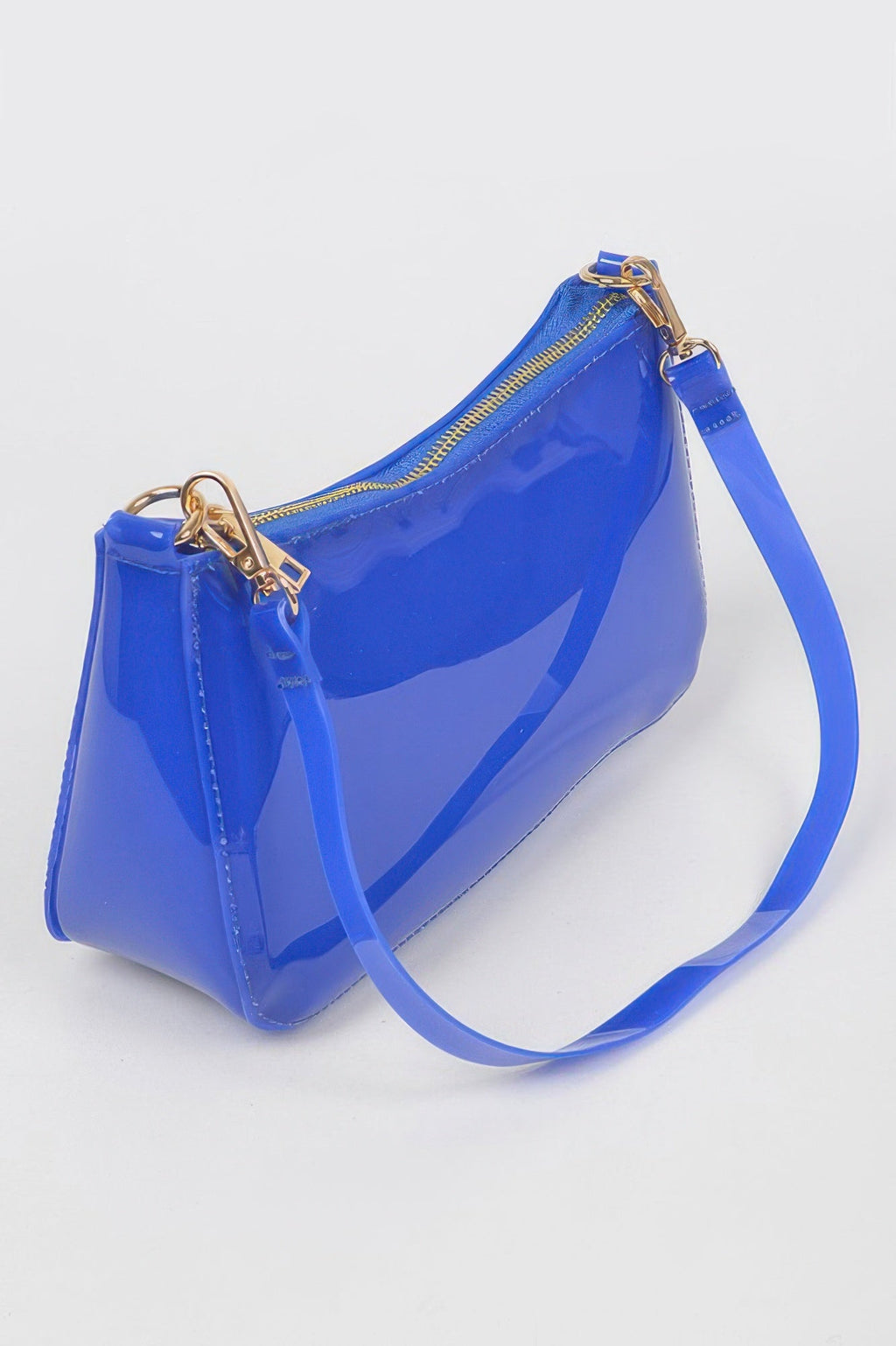 Cobalt Transparent Shoulder Bag, angled view showing the top zipper and gold hardware