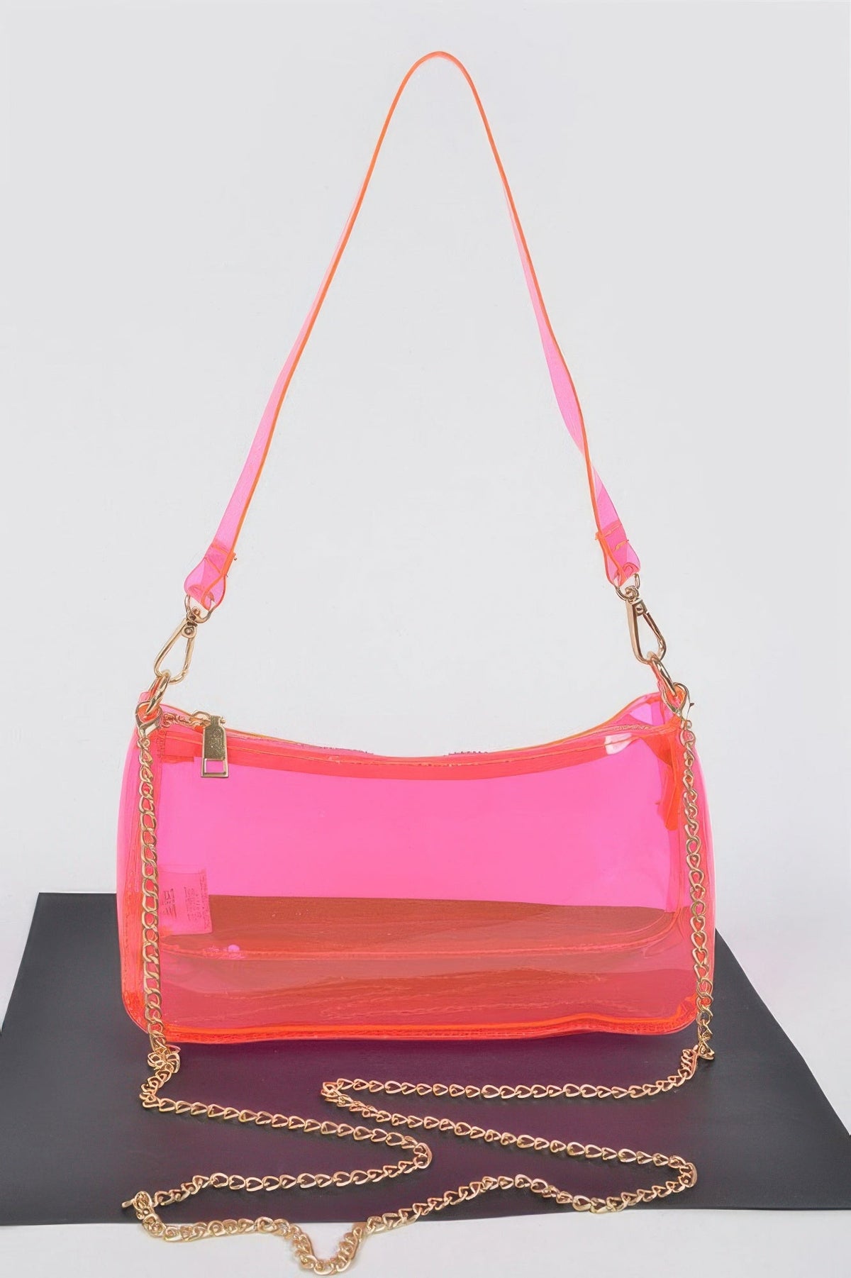Neon pink Transparent Shoulder Bag with matching shoulder strap and gold chain