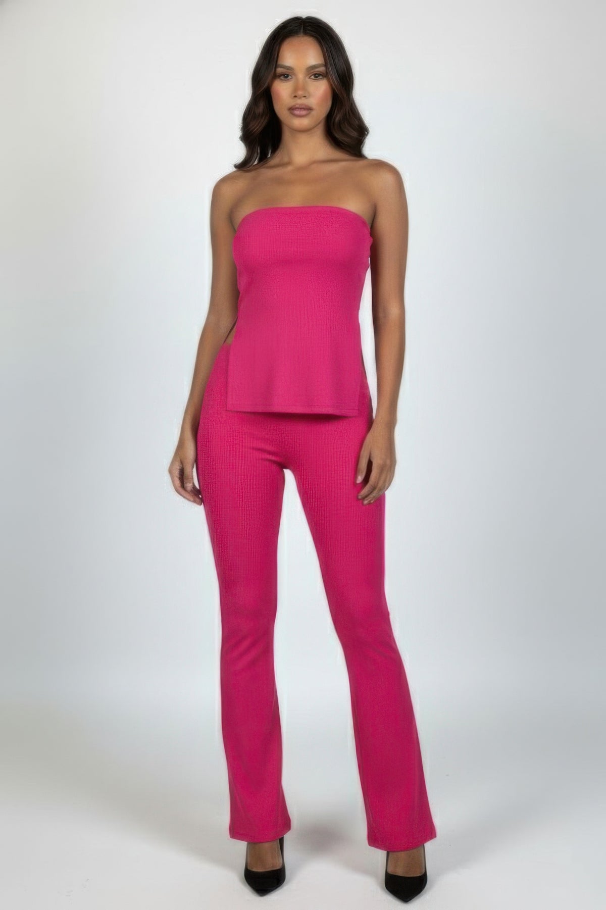 Front view of the fuchsia strapless ribbed slit tube top and high-waist flare pants set