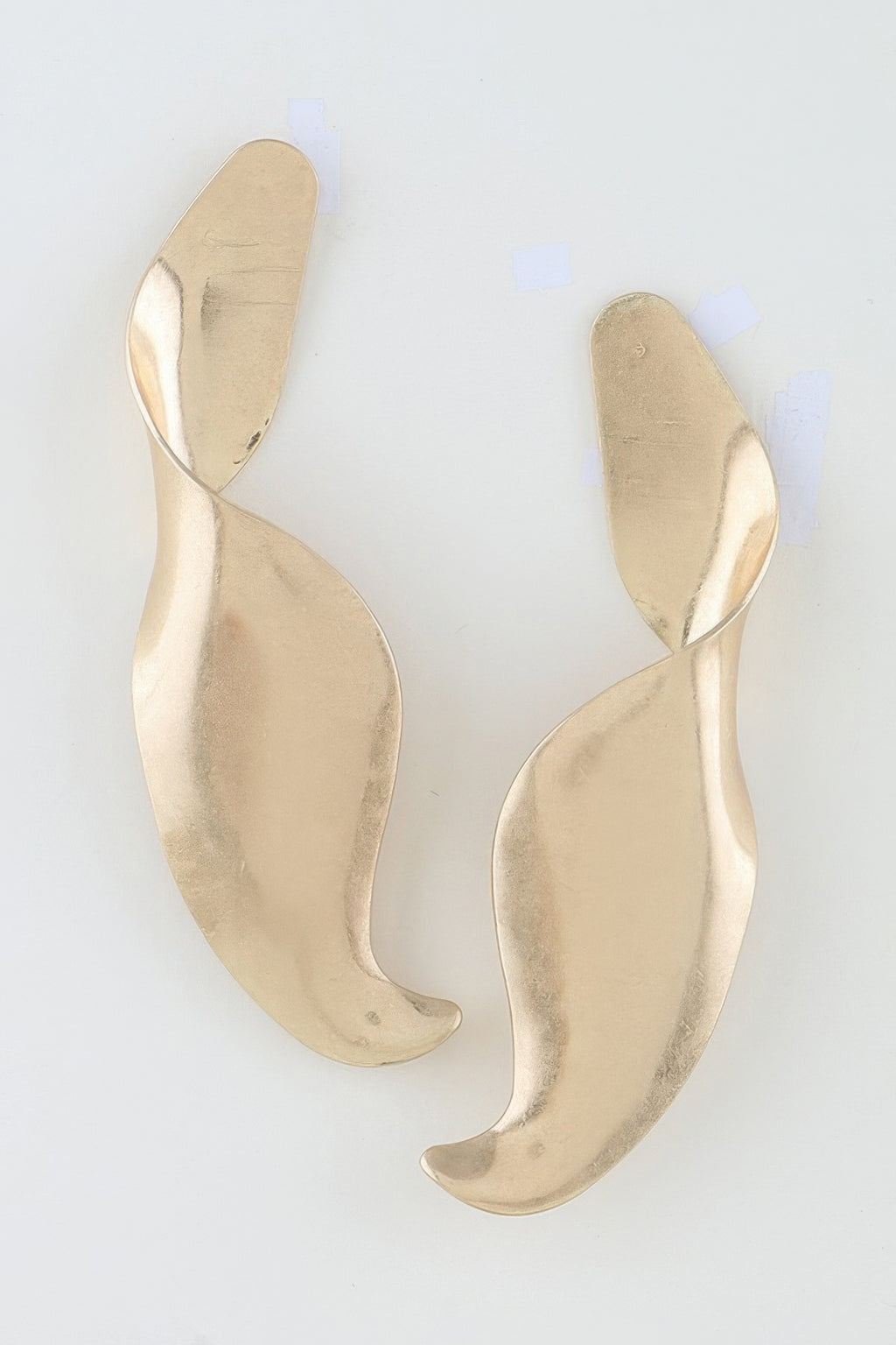 Pair of gold-tone Liquid Motion sculptural swirl earrings