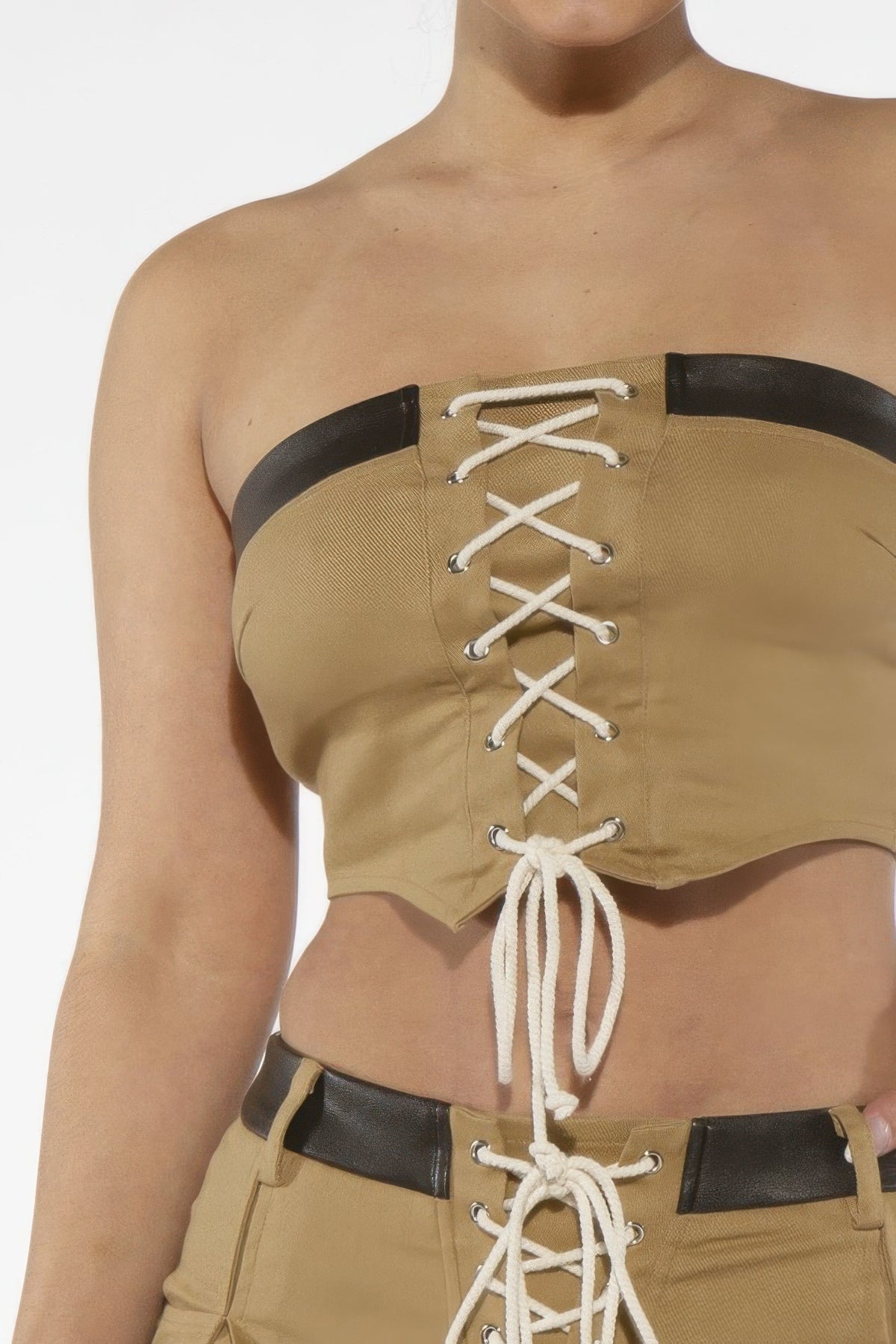 Close front view of khaki Desert Laced Corset Top with black upper band and white crisscross lacing