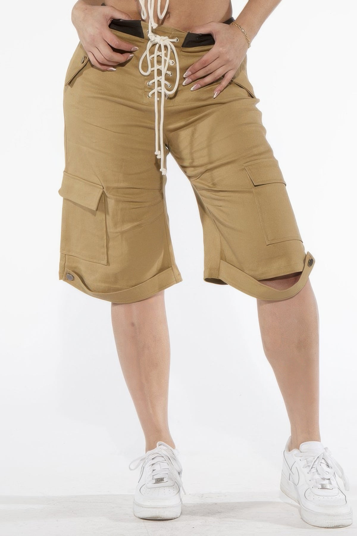 Front view of the khaki lace-up cargo Bermuda shorts with thigh pockets and snap-tab hems