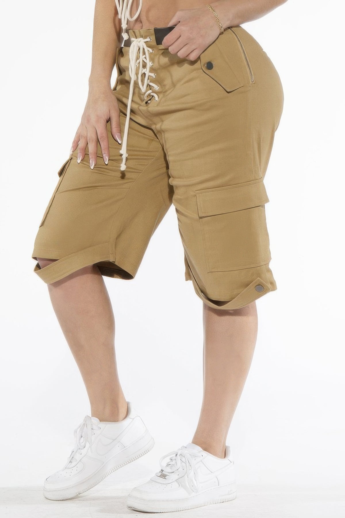 Three-quarter front view of the khaki cargo Bermuda shorts and curved hem straps