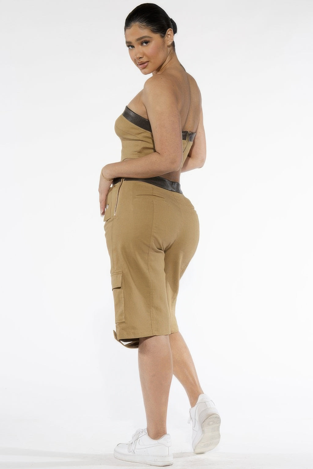 Back view of the khaki cargo Bermuda shorts with contrast waistband and utility pockets