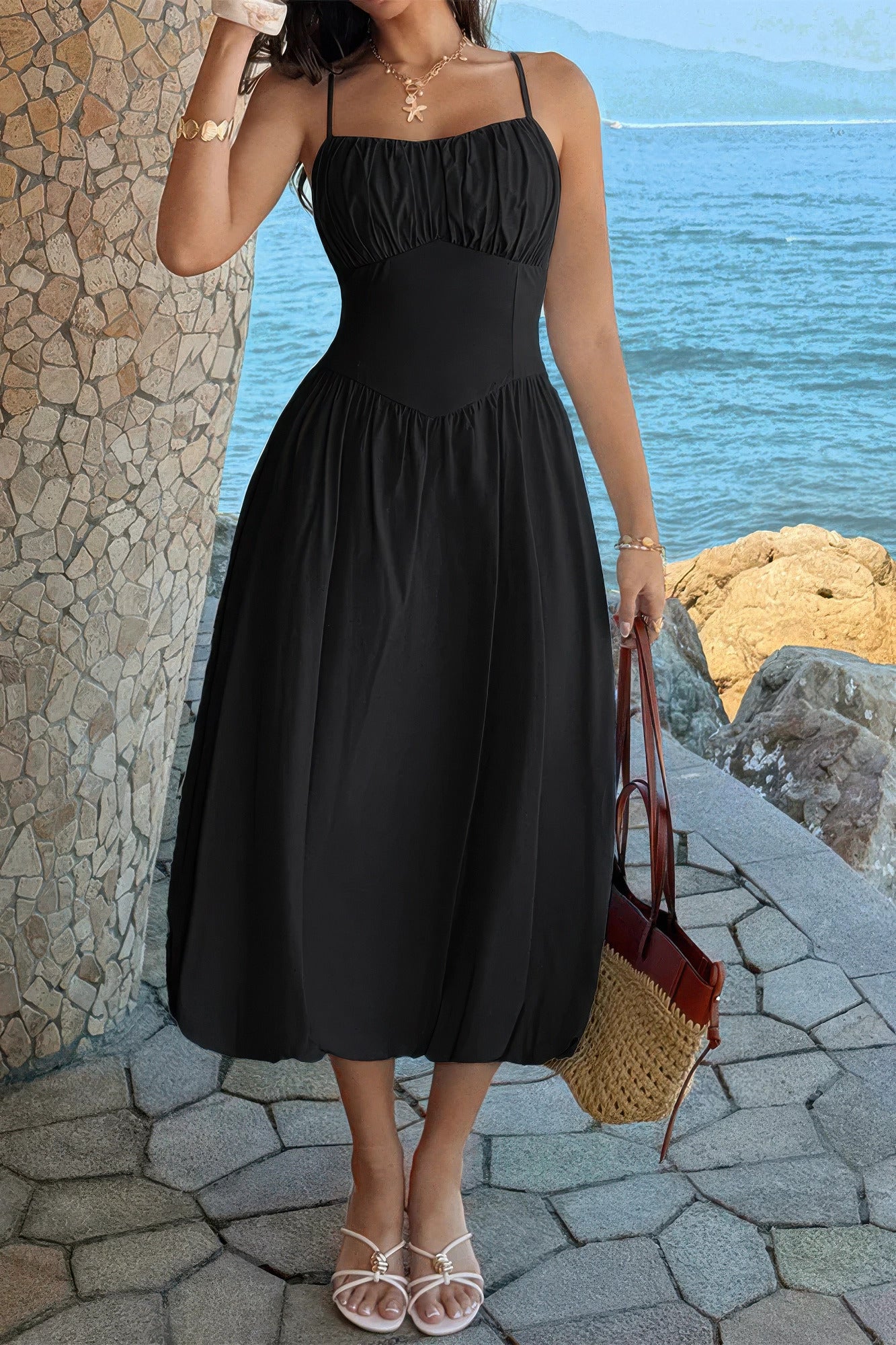 Black ruched-bust A-line midi dress, front three-quarter view