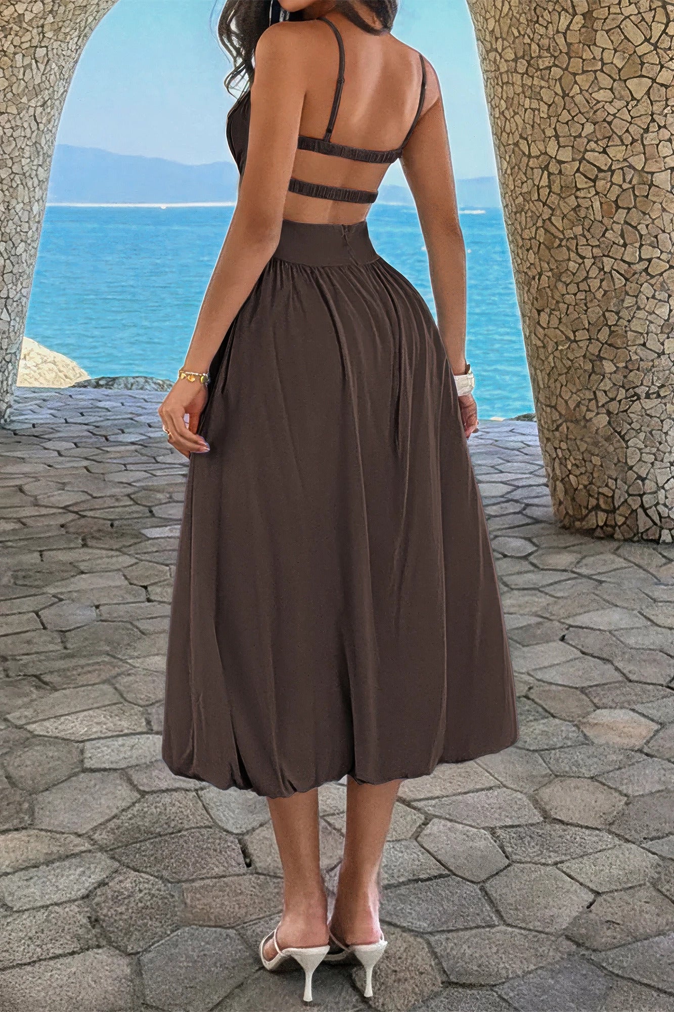 Back view of the brown dress showing the open back and two horizontal elastic bands