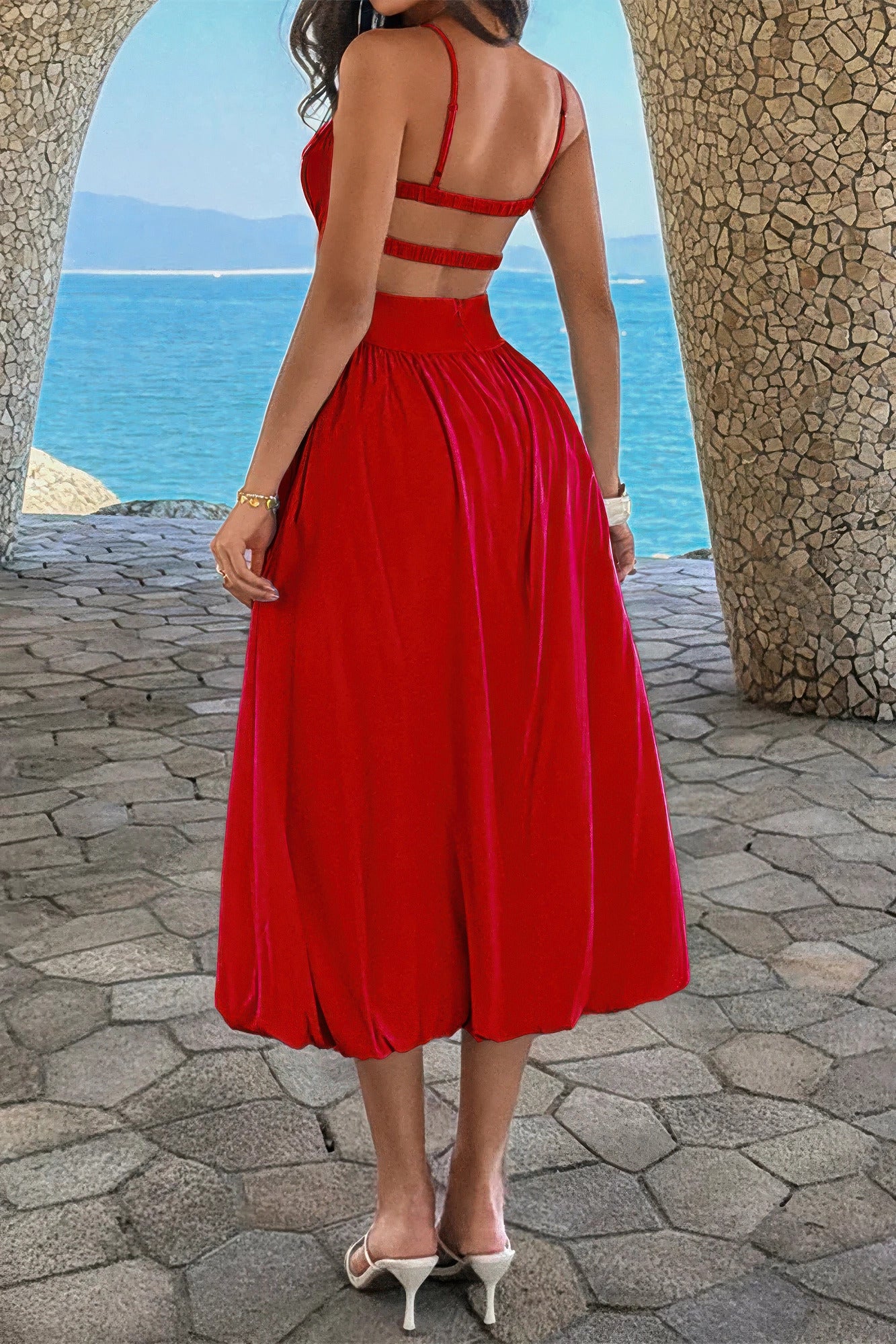 Back view of the red dress showing the open back, elastic bands and waist closure