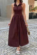 Model wearing the brown Executive Hour belted midi dress, full front view