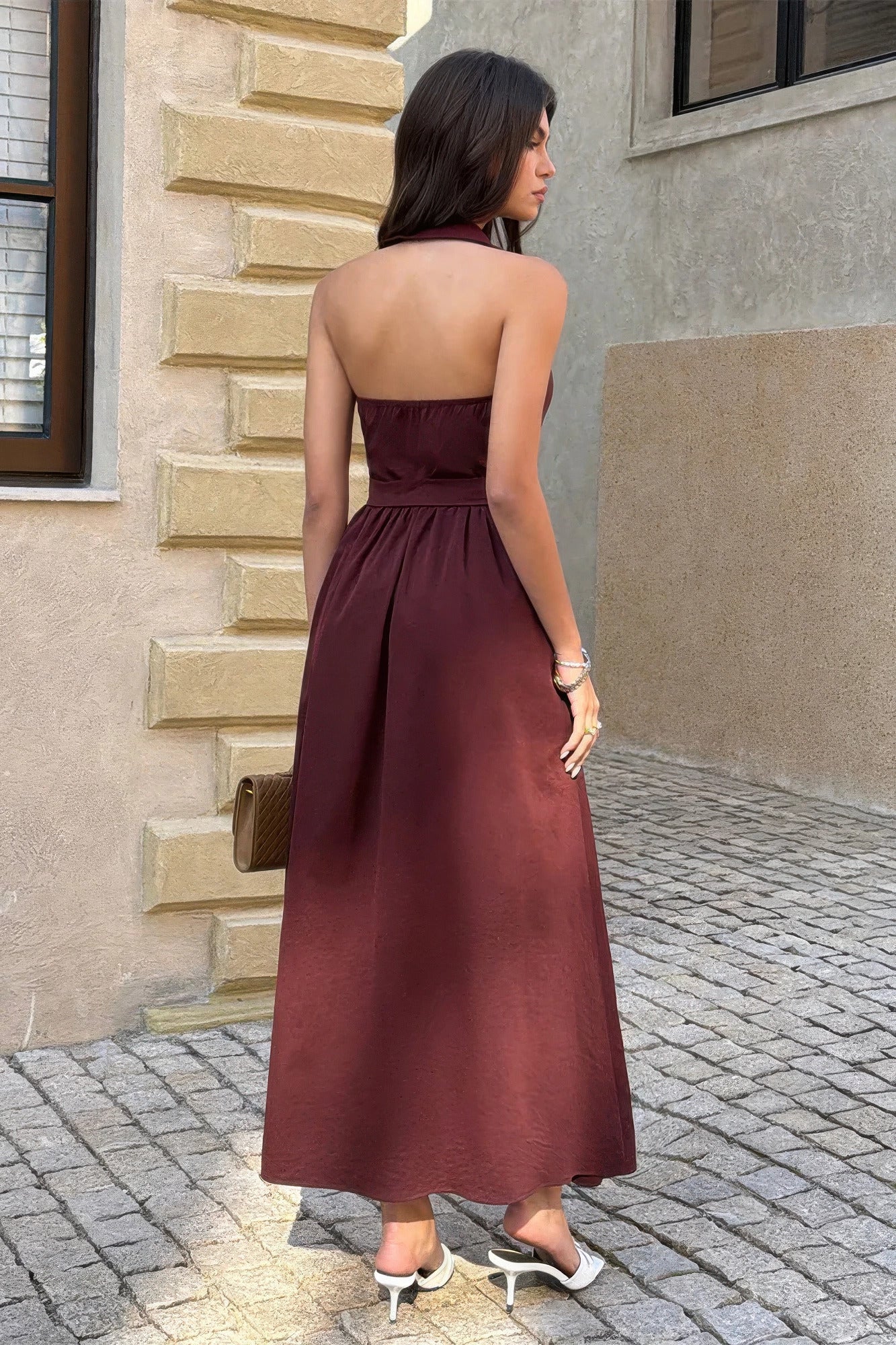 Back view of the brown sleeveless belted midi dress