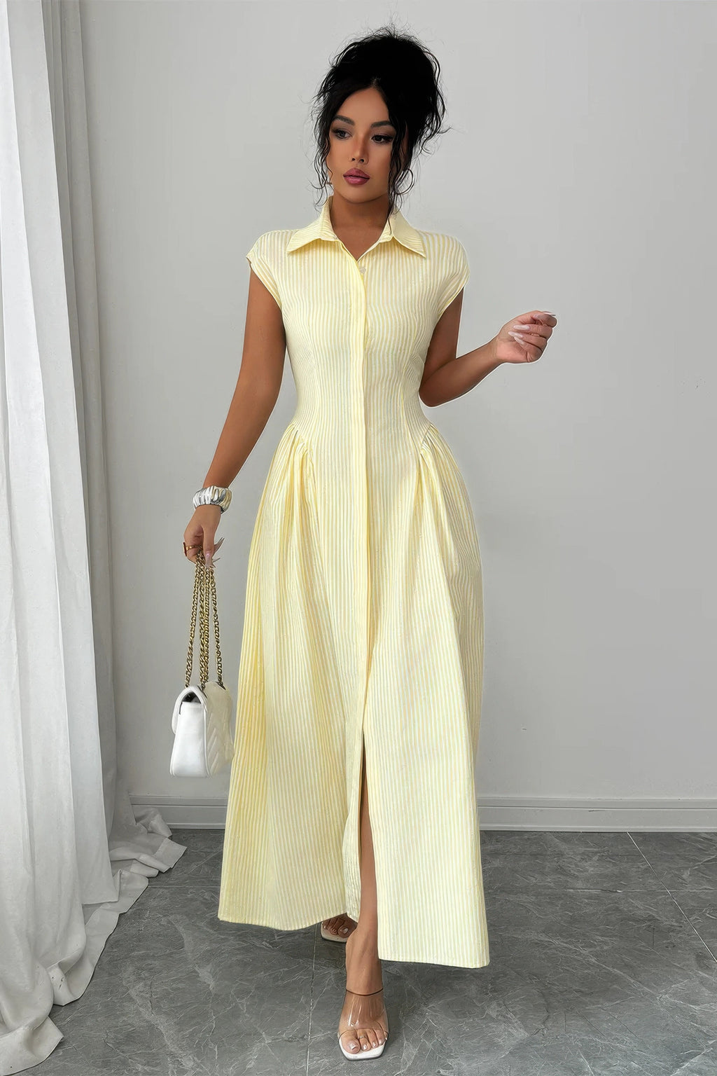 Yellow pinstripe ruched-waist long dress styled with front slit open