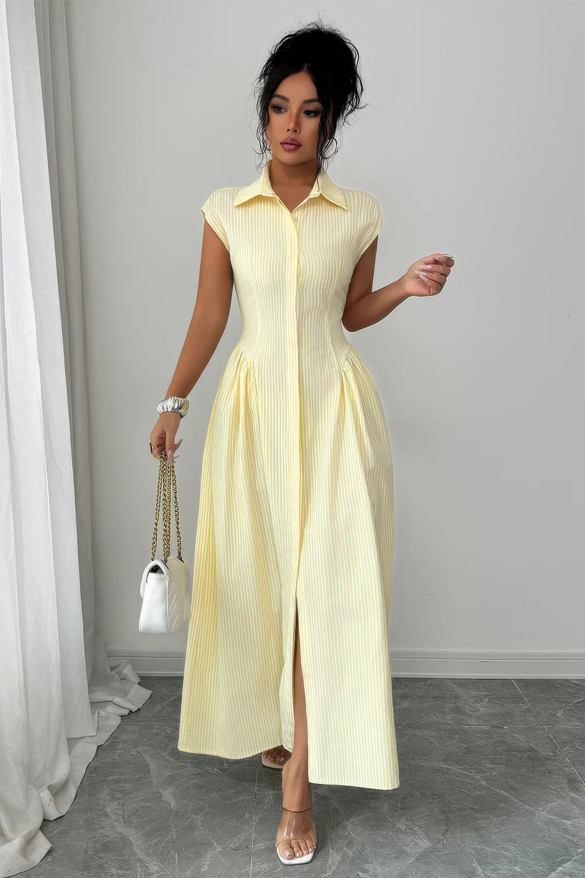 Yellow pinstripe ruched-waist long dress styled with front slit open
