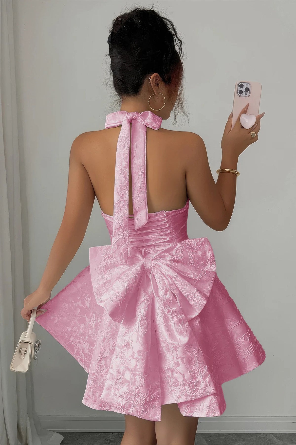 Pink Privilege Halter Mini Dress open-back view with halter tie and oversized bow