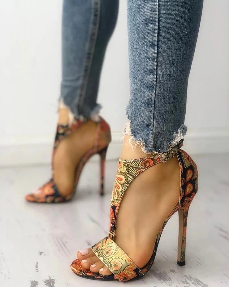 Golden Hour Print Stiletto Sandals supplier reference view 6 showing bronze multicolor ornate-print open-toe sandals with ankle straps and slim stiletto heels