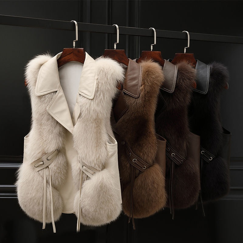 Soft Power Faux-Fur Vest in white, camel, coffee, and black displayed together on wooden hangers.