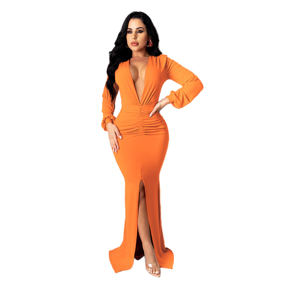 Closer front view of the orange Spotlight Status Plunge Maxi Dress showing its gathered waist and front slit.