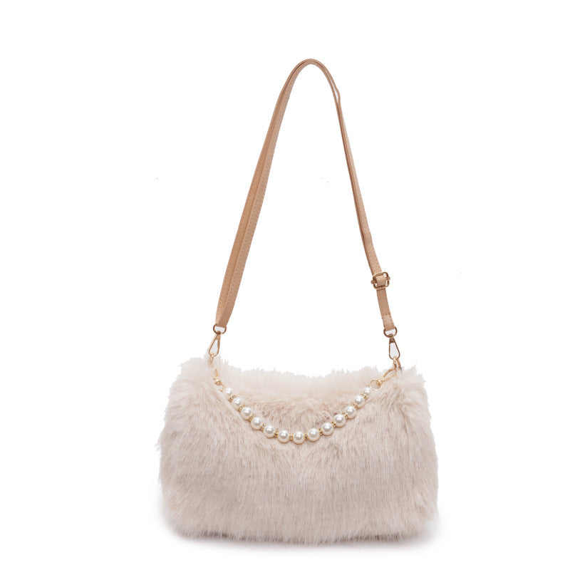 Khaki plush shoulder bag with pearl-style front row and adjustable single strap on a white background.