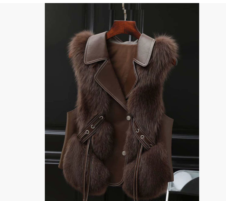 Coffee Soft Power Faux-Fur Vest front view on a wooden hanger.