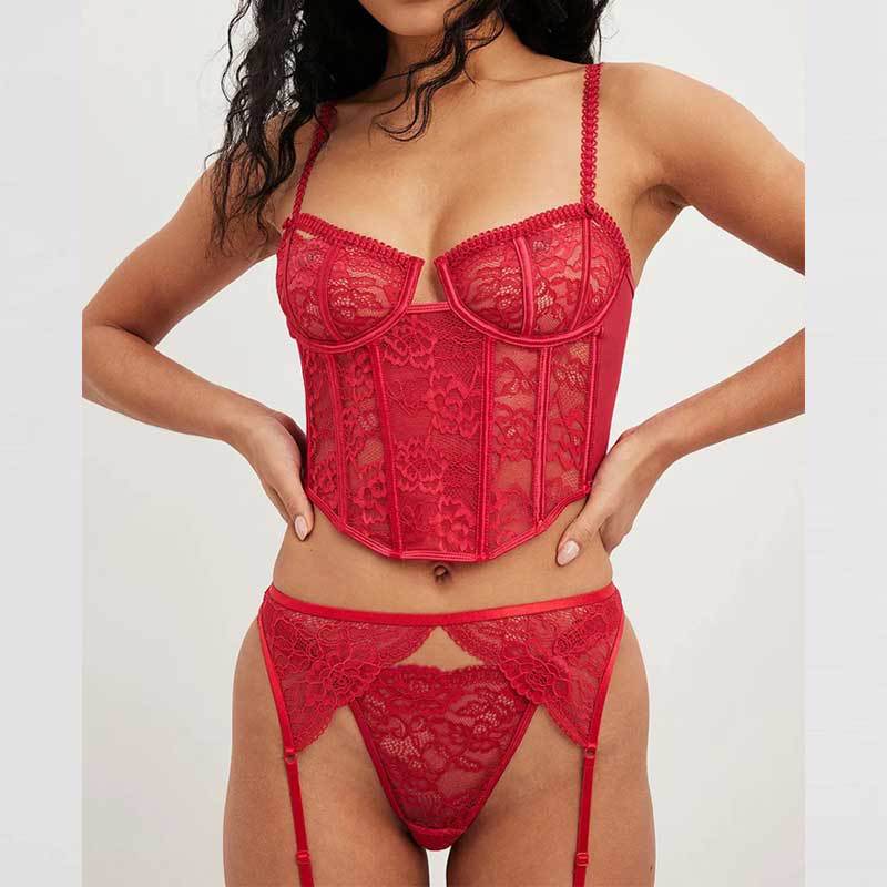 Adult model wearing the red three-piece lace set with corset bra, underpants, and garter belt